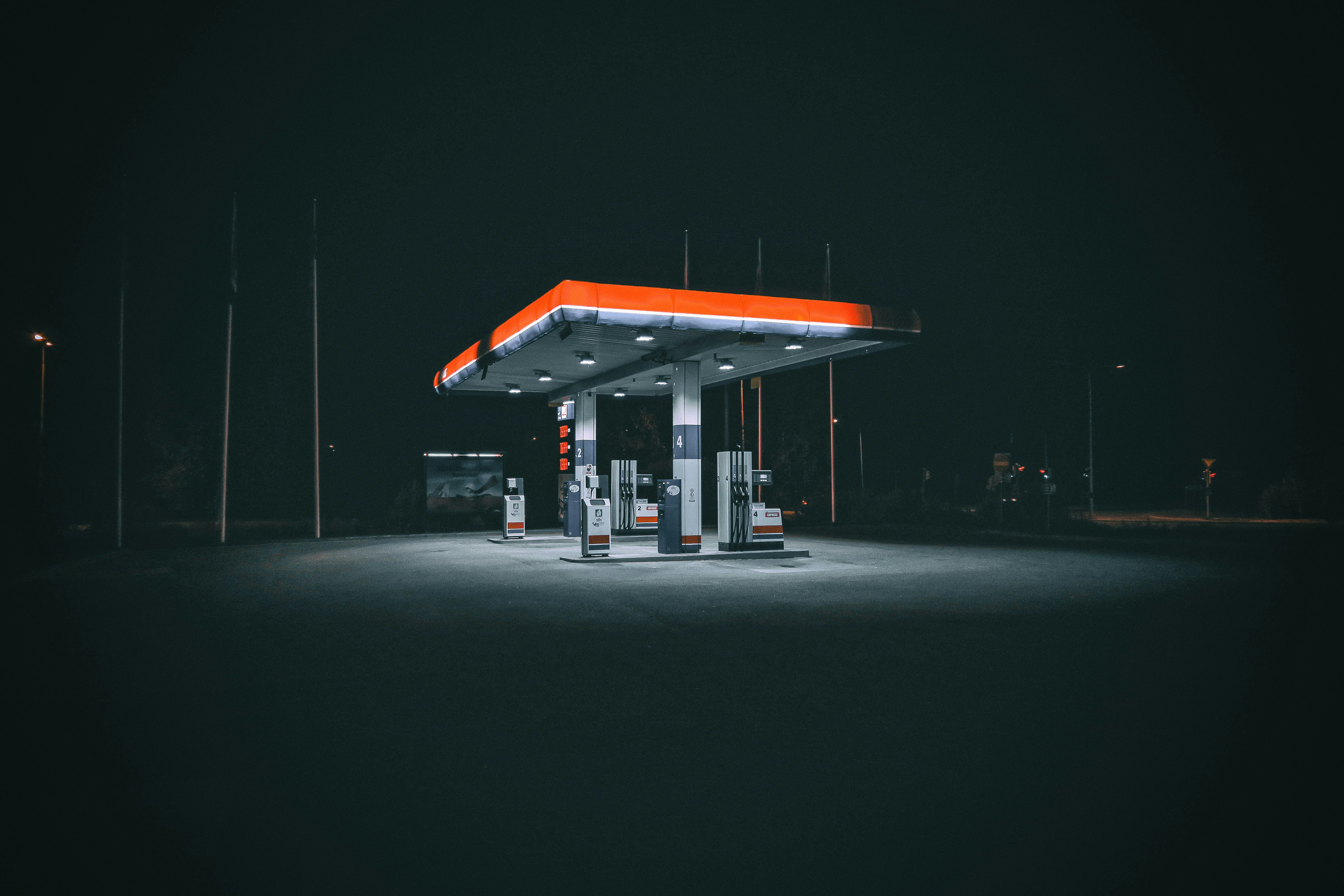 Nozzo fuel station illuminated at night